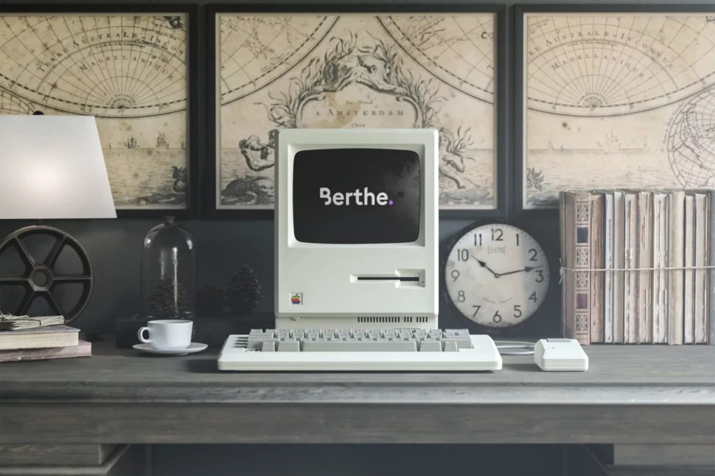 Logo Berthe affiché sur un ancien ordinateur Macintosh
